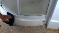 wiping shower caulk seams clean