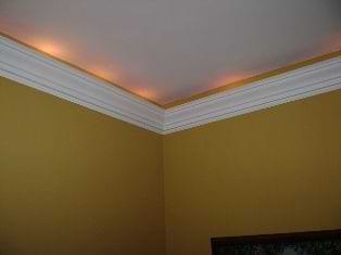 crown molding with string lights in a dining room
