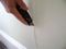 cutting out bubbling drywall tape