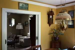 photo vintage dining room with yellow walls, a white ceiling, and white trim