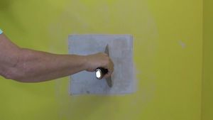 the wall patch is held in place with the first coat of joint compound