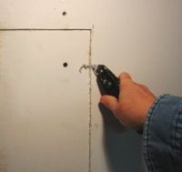 trimming around a new drywall patch