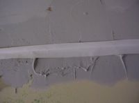 taping aninside drywall corner
