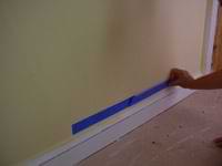 using masking tape to mark a straight line on trim molding