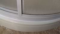 new silicone caulk around a shower stall