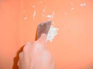 photo scraping water-damaged walls