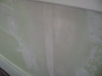first skim coat over damaged drywall tape