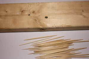 photo wood hole and toothpicks