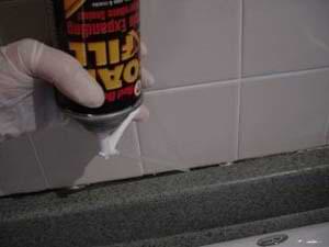 photo using expanding foam to fill a crack photo using expanding foam to fill a crack