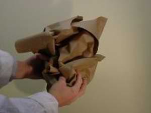 photo demonstrating how to crumple craft paper to create a faux painting finish photo demonstrating how to crumple craft paper to create a faux painting finish
