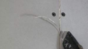 photo trimming rough drywall paper with a sharp knife photo trimming rough drywall paper with a sharp knife