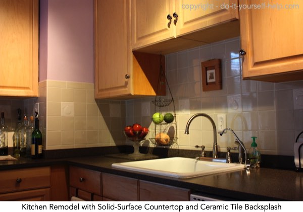 photo solid-surface countertop and ceramic tile backsplash