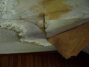 photo water-damaged old plasterboard and wallpaper