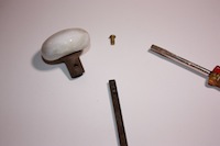 photo of parts of a house door handle assembly photo of parts of a house door handle assembly