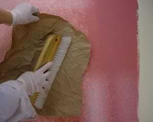 photo blotting wet painting glaze with craft paper to perfect a faux finish on a wall photo blotting wet painting glaze with craft paper to perfect a faux finish on a wall