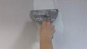photo applying a first coat of joint compound over a drywall butt joint photo applying a first coat of joint compound over a drywall butt joint
