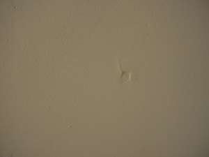 photo a drywall nail pop photo a drywall nail pop