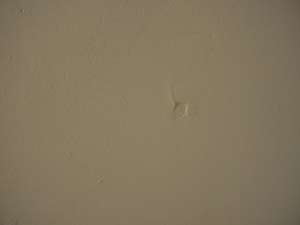 photo a drywall nail pop