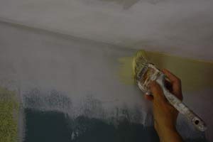photo brushing wall paint along a ceiling corner photo brushing wall paint along a ceiling corner