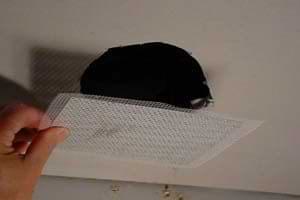 photo sticking a patch over a ceiling hole photo sticking a patch over a ceiling hole