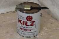 photo of a can of kilz primer and a paint brush photo of a can of kilz primer and a paint brush