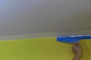 photo pulling masking tape off a wall after painting photo pulling masking tape off a wall after painting