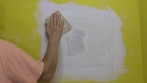 photo sanding a drywall patch photo sanding a drywall patch