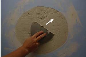 photo scraping to smooth dry repair compound