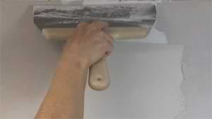 photo applying a second coat of joint compound over a drywall butt joint photo applying a second coat of joint compound over a drywall butt joint