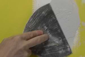 photo spreading joint compound over torn drywall paper photo spreading joint compound over torn drywall paper