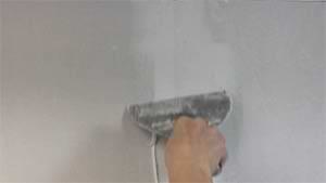 photo skimming joint compound over fiberglass tape on a drywall butt joint photo skimming joint compound over fiberglass tape on a drywall butt joint