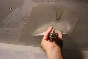 photo smoothing joint compound over an aluminum patch photo smoothing joint compound over an aluminum patch