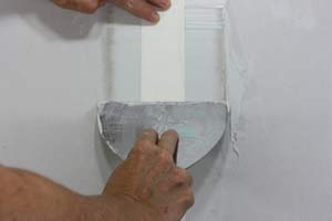 photo sticking paper drywall tape to a drywall seam photo sticking paper drywall tape to a drywall seam