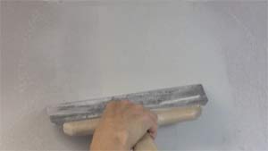 photo skimming joint compound over the center of a drywall butt joint photo skimming joint compound over the center of a drywall butt joint