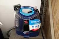photo of a canister-type carpet cleaner photo of a canister-type carpet steamer