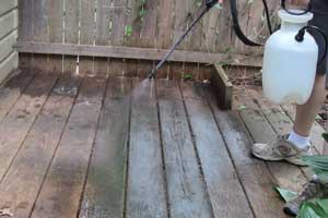 photo spraying oxygen bleach onto a deck photo spraying oxygen bleach onto a deck