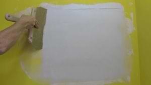 photo smoothing a third coat of joint compound over a drywall patch photo smoothing a third coat of joint compound over a drywall patch