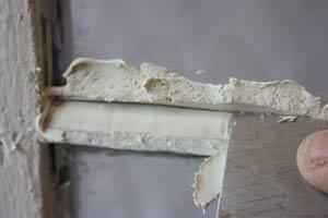 photo smoothing out new window glazing with a putty knife photo smoothing out new window glazing with a putty knife