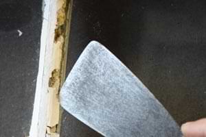 photo forcing old glazing off a window glass pane with a putty knife photo forcing old glazing off a window glass pane with a putty knife